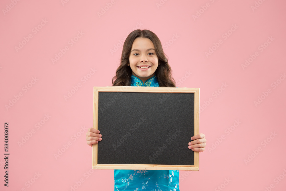 Information for you. Happy girl hold blackboard pink background. Small kid smile with blank blackboard. Little schoolchild got blackboard for lesson. Blackboard for advertising text, copy space Information for you. Happy girl hold blackboard pink background. Small kid smile with blank blackboard. Little schoolchild got blackboard for lesson. Blackboard for advertising text, copy space