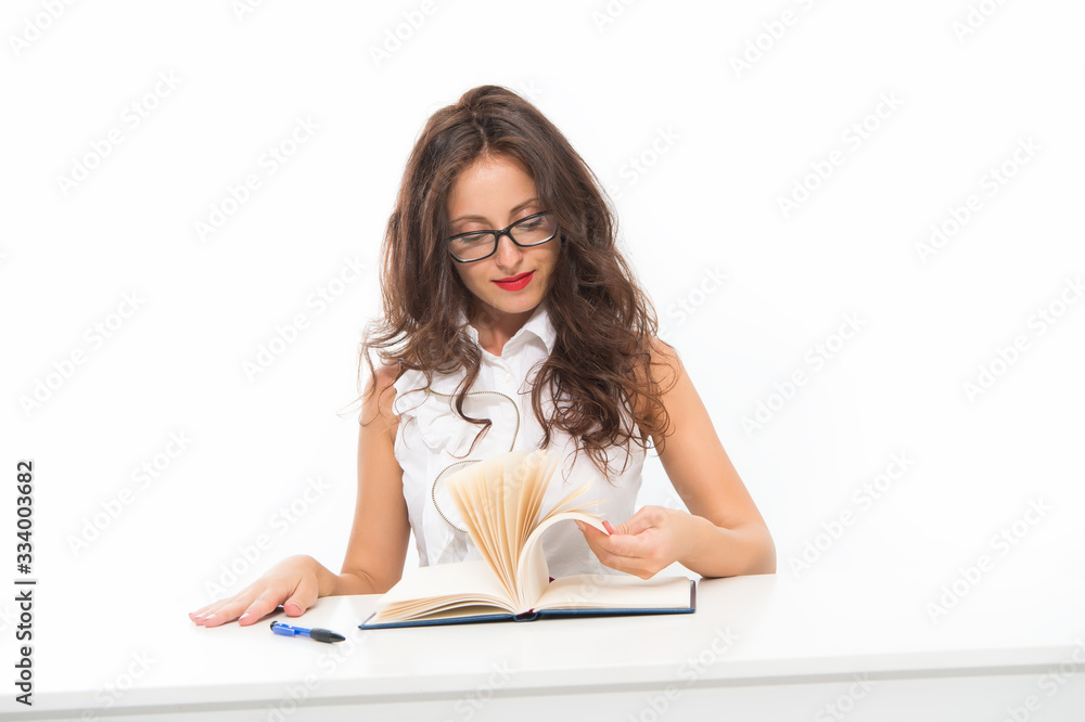 Elegant female office assistant in formal wear at work. Business administration concept. Sexy secretary at her office desk. sexy schoolgirl writing in copybook. young attractive teacher read book Elegant female office assistant in formal wear at work. Business administration concept. Sexy secretary at her office desk. sexy schoolgirl writing in copybook. young attractive teacher read book