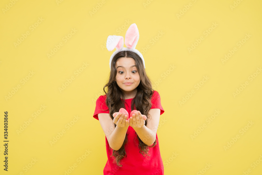 Fun and educational Easter activity for kids. Little girl easter eggs. Cute cheerful bunny schoolgirl celebrate Easter day. Preparing decorations. Funny games. Indoor and outdoor holiday activities