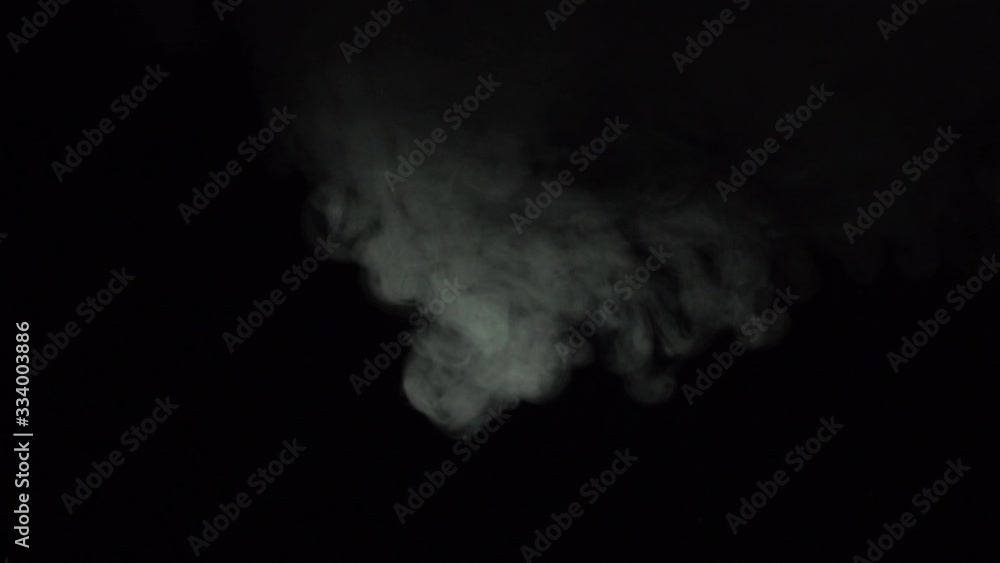 Atmospheric smoke Fog effect. Haze background. Abstract smoke cloud. Smoke in slow motion on black background. White smoke slowly floating through space against black background. Atmospheric smoke Fog effect. Haze background. Abstract smoke cloud. Smoke in slow motion on black background. White smoke slowly floating through space against black background.