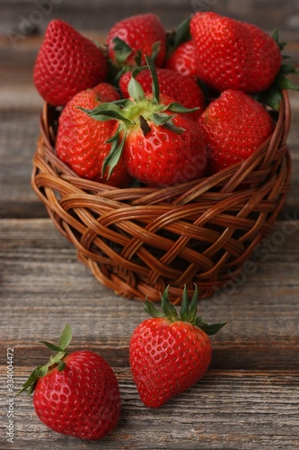 Delicious juicy strawberries on a wooden table