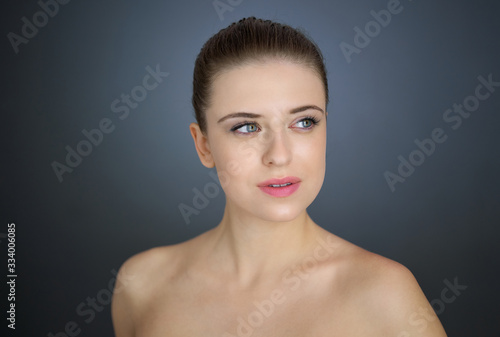 Portrait of nice pretty blonde lady isolated over grey background. Beauty and lifestyle concepts