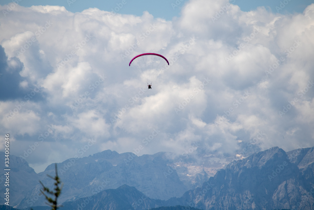 Panorama of the Austrian Alps,Europe,at Lake Ossiacher See with the mountains of the Karawanken Mountains with paragliders Panorama of the Austrian Alps,Europe,at Lake Ossiacher See with the mountains of the Karawanken Mountains with paragliders