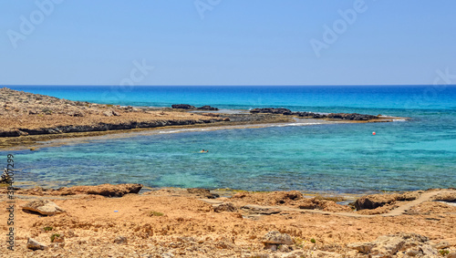 Cyprus island  beautiful beach lagoon near Ayia Napa. Turquoise sea water in one of the secluded beaches in Ayia Napa. Secluded and calm wild beach in Mediterranean sea  on Cyprus island.