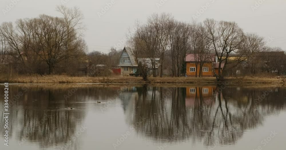 Small pond and old houses in the suburbs near Leningradskoye Shosse Small pond and old houses in the suburbs near Leningradskoye Shosse
