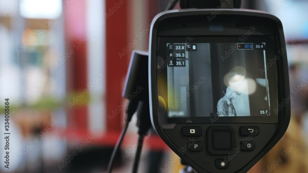 Temperature Check Commercial Temperature check at a supermarket, grocery store with thermal imaging ...