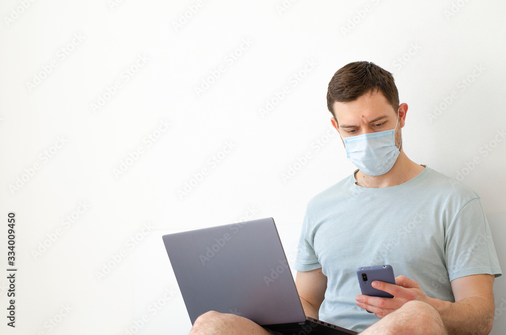 Coronavirus. Quarantine. A man solves questions on work remotely. Coronavirus. Quarantine. A man solves questions on work remotely.