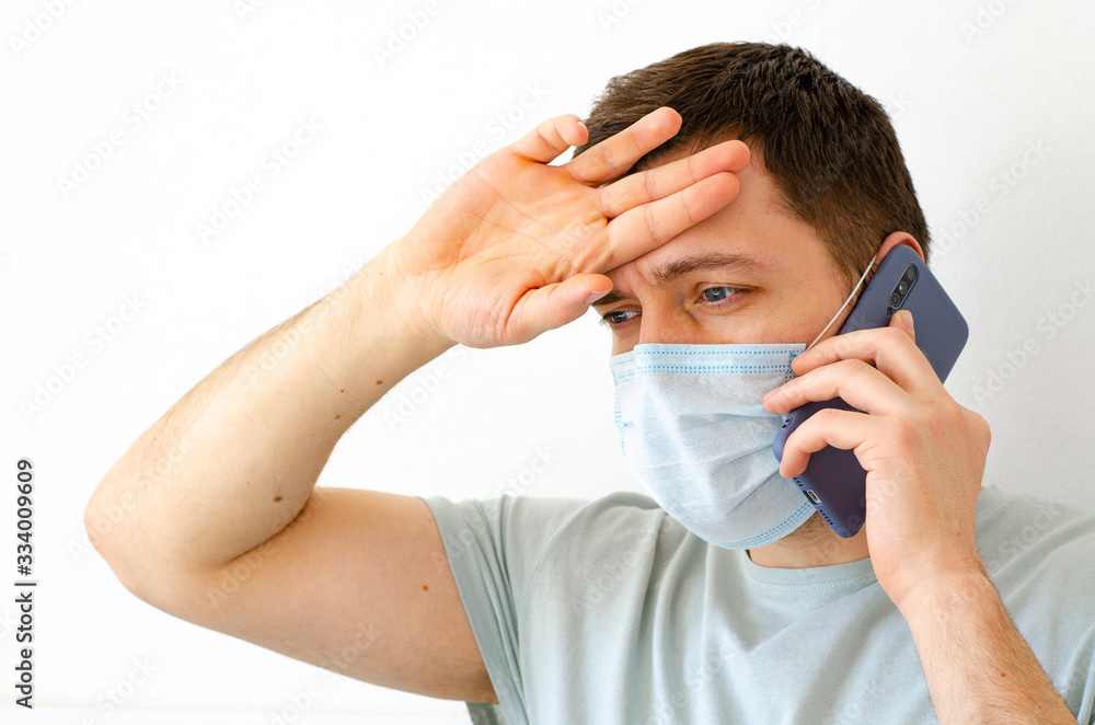 Coronavirus. Quarantine. A man calls a doctor. Fever, cough. Complaint about symptoms. Coronavirus. Quarantine. A man calls a doctor. Fever, cough. Complaint about symptoms.