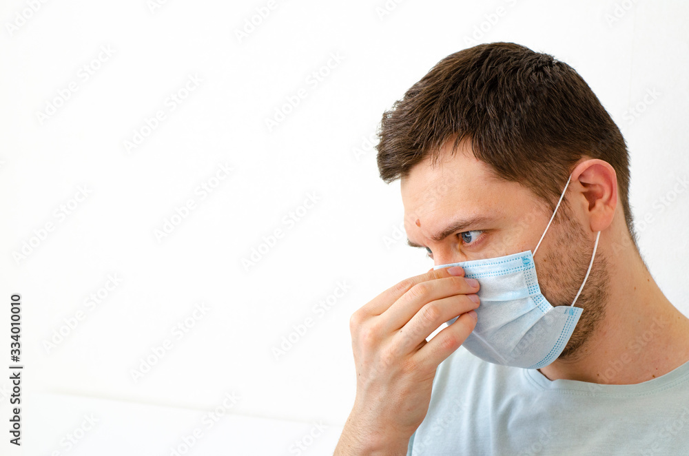 Coronavirus. Quarantine. A man puts on a mask. Virus protection. Coronavirus. Quarantine. A man puts on a mask. Virus protection.