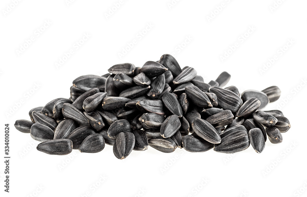 Sunflower seeds isolated on a white background, close up. Sunflower seeds isolated on a white background, close up.