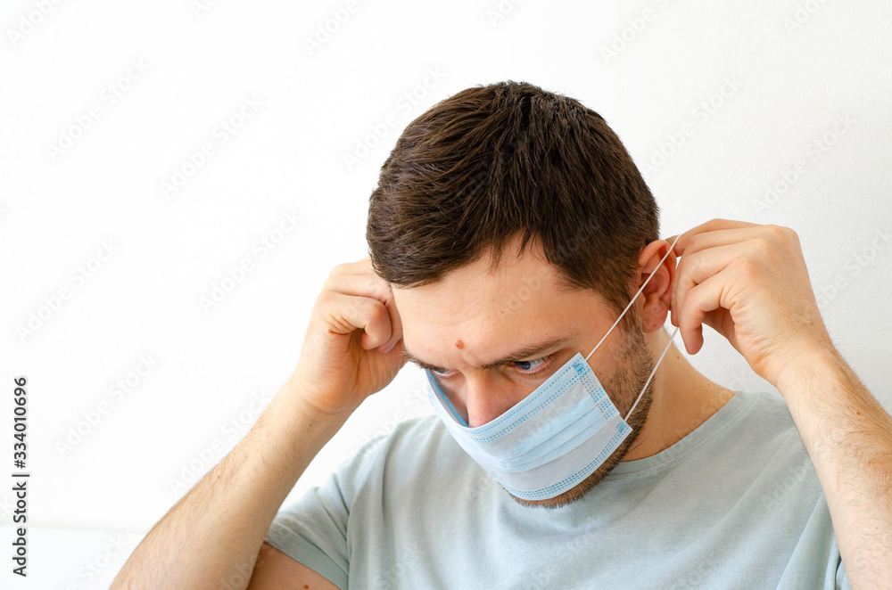 Coronavirus. Quarantine. A man puts on a mask. Virus protection. Coronavirus. Quarantine. A man puts on a mask. Virus protection.