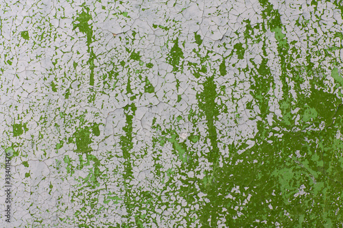 Fototapeta Naklejka Na Ścianę i Meble -  Green and grey old wall texture.  Old cracked painted green and grey wall. Creative background. 