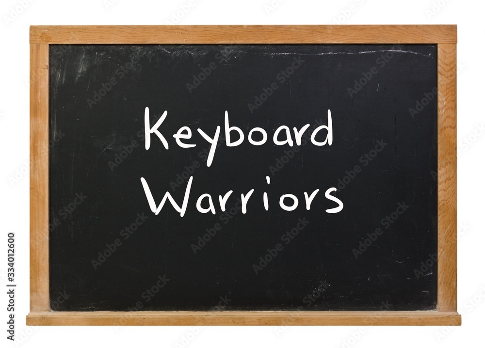 Keyboard warriors written in white chalk on a black chalkboard isolated on white