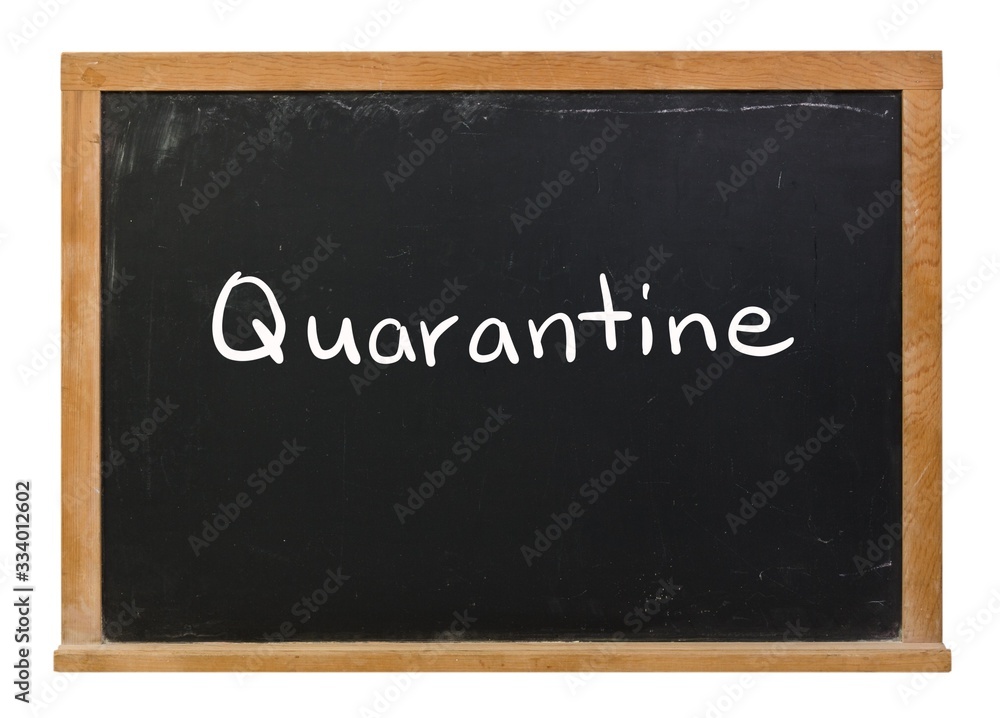 Quarantine written in white chalk on a black chalkboard isolated on white Quarantine written in white chalk on a black chalkboard isolated on white