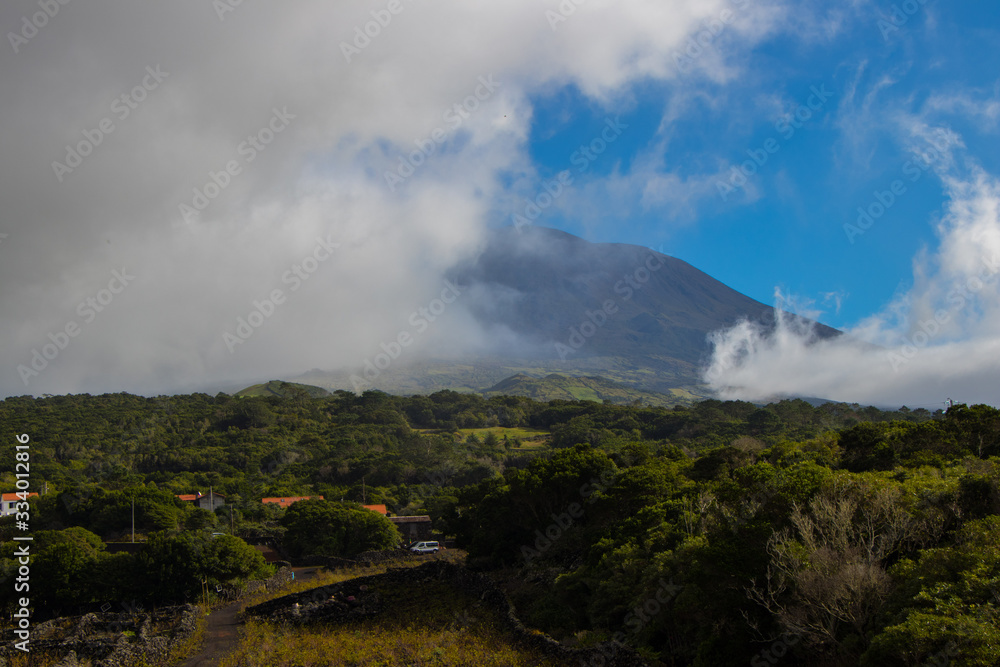 Pico mountain, lava rock, Madalena, Pico, Azores islands, Portugal. Panoramic landscape view.