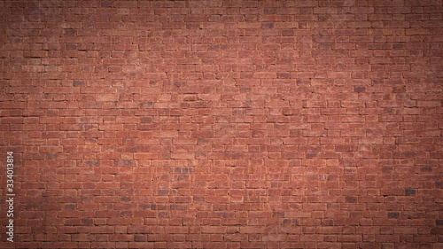 Full frame image of the old painted red brick wall. High resolution texture (16:9 format) with vignetted corners for background, poster, collage in grubge, urban, loft style