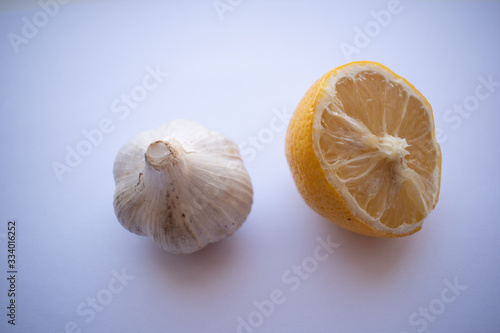 Garlic and lemon on a white background