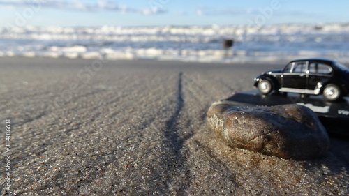 Stein am Meeresstrand - Hintergrund Kinderspielzeug