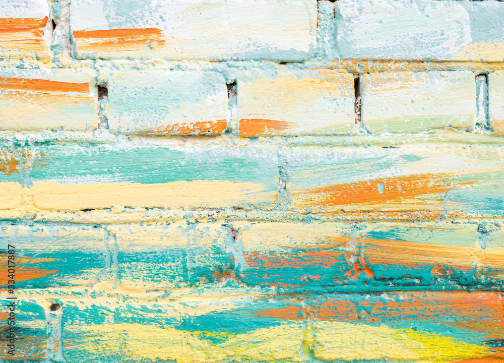 Colorful paint marks on a brick wall. Abstract painting colorful