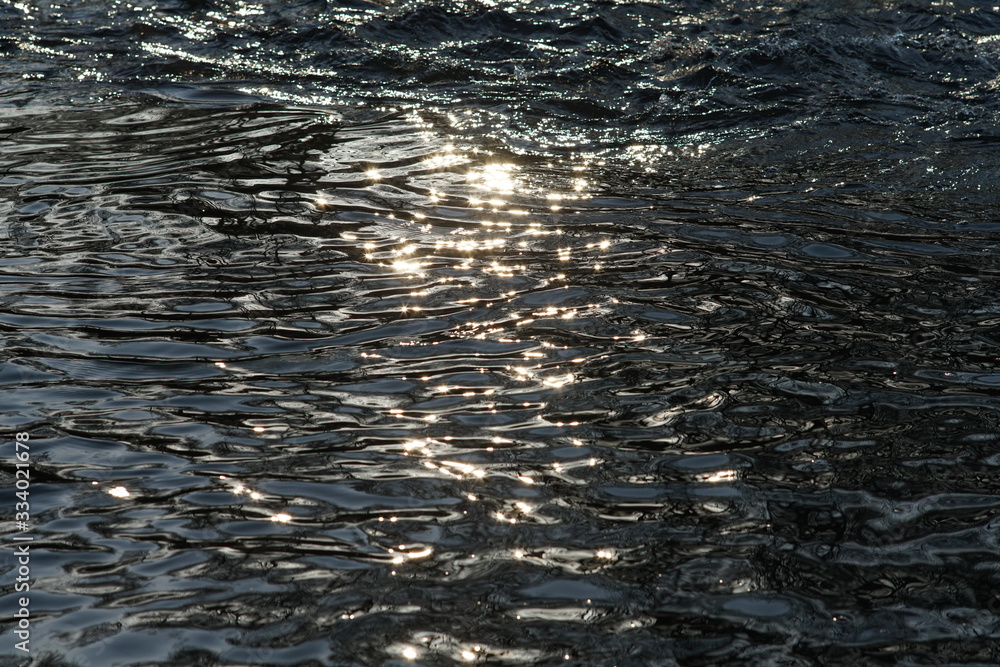 Fototapeta premium Rapidly flowing river with reflections