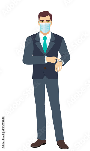 Businessman with medical mask pointing at his watch. Full length portrait of Businessman in a flat style.