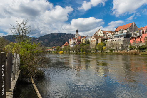 Spring in Frohnleiten- small town above Mur river in Styria, Austria. View at Parish church, town and river Mur. Famous travel destination.