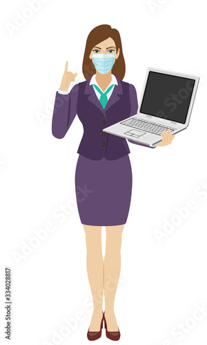 Businesswoman with medical mask holding a laptop notebook and pointing up. Full length portrait of businesswoman in a flat style.