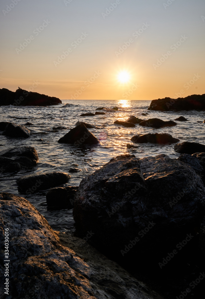 the sunset at the background in the atlantic ocean, Punta Ballena, Maldonado, Uruguay the sunset at the background in the atlantic ocean, Punta Ballena, Maldonado, Uruguay