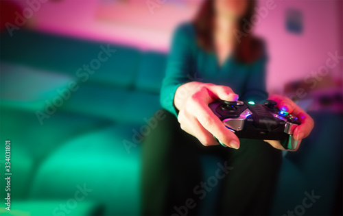 Woman playing video games in the living room