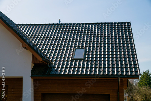 Принти на полотні A newly built house. The roof is made of ceramic tiles.