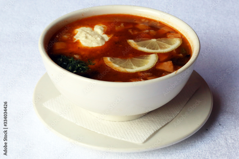 Combined hodgepodge soup with sour cream, dishes of Russian national cuisine Combined hodgepodge soup with sour cream, dishes of Russian national cuisine