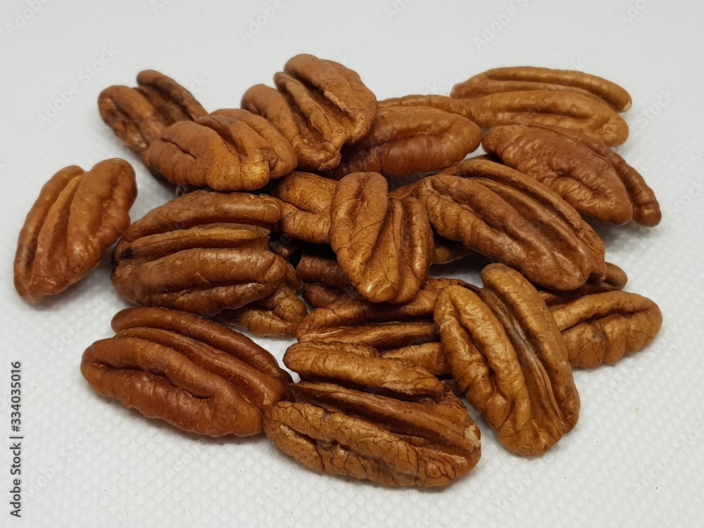 A bunch of walnuts on a white background A bunch of walnuts on a white background