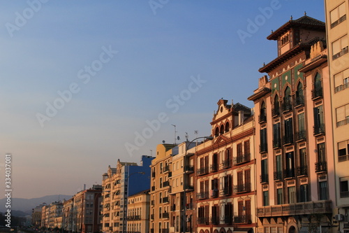 Traditional buildings of Malaga city at sundown in Andalusia, Spain.