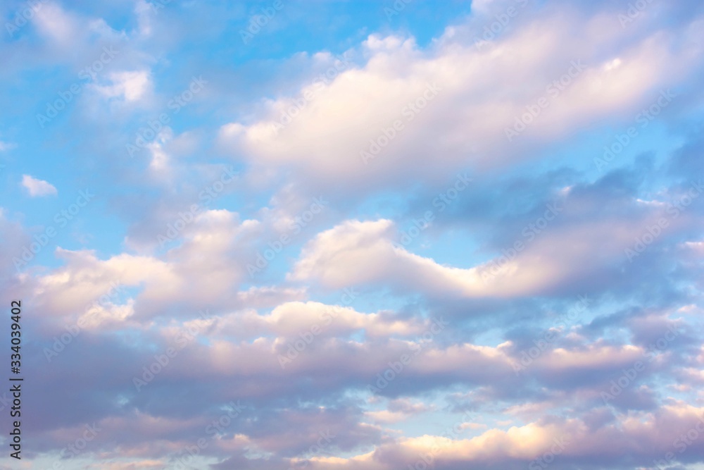 Large floating clouds in the sky at sunset day. Large floating clouds in the sky at sunset day.