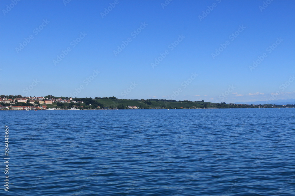 Meersburg city view taken from a passenger boat on Lake Constance raised anchor from Konstanz city in Baden-Wuerttemberg state in Germany.