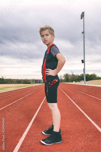 young track triathlon boy standing on running track © 303Photos.com