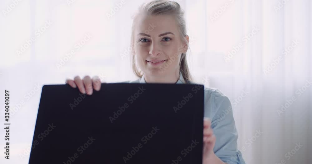 Smiling Woman Working on Laptop at Home Office. Businesswoman Typing on Computer Keyboard. Smiling Woman Working on Laptop at Home Office. Businesswoman Typing on Computer Keyboard.