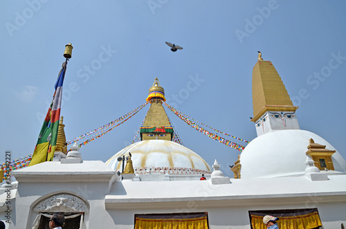 Beautiful Boudhanath stupa in Kathmandu, Nepal. The Buddha Stupa dominates the skyline; it is one of the largest stupas in the world. photo