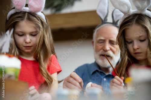 Concentrated family getting ready for Easter stock photo