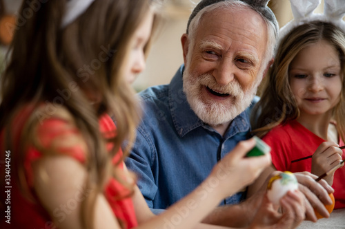 Excited grandfather looking at his granddaughter stock photo