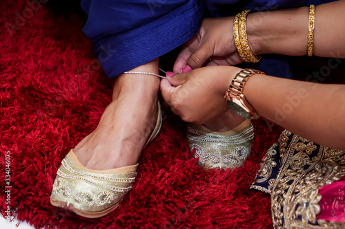 Indian bride's pre wedding shoes and feet close up
