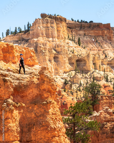 Woman hiking through the stunning Bryce Canyon in Utah, United States. Taken in the beautiful, warm summer. 