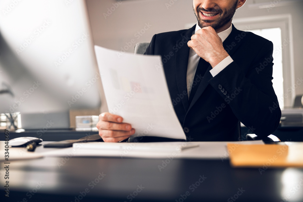 Cropped photo of Caucasian businessman working in office Cropped photo of Caucasian businessman working in office