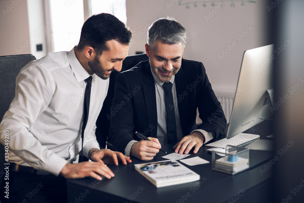 Office workers are smiling at their workplace Office workers are smiling at their workplace