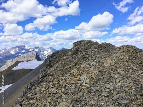 High in the rocky mountains doing the Northover Ridge hike in Kananaskis, Alberta, Canada.  This portion of the ridge is scree or small, loose rocks covering the slope of the ridge.