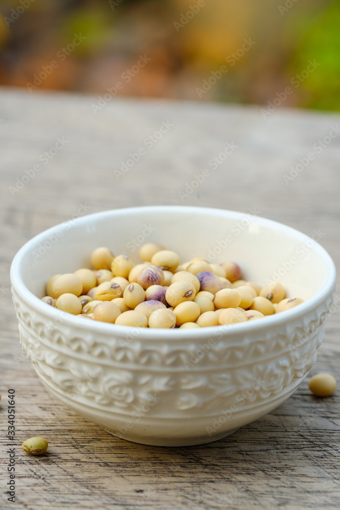 Soy bean in bowl on wooden floor Soy bean in bowl on wooden floor