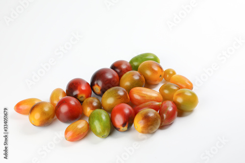 Fresh ripe mixed tomato verity assorted color on white background