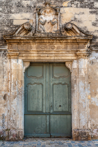 Weathered doorway in old stone wall