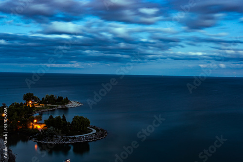 view of sea at sunset with clouds and blue sky © nur