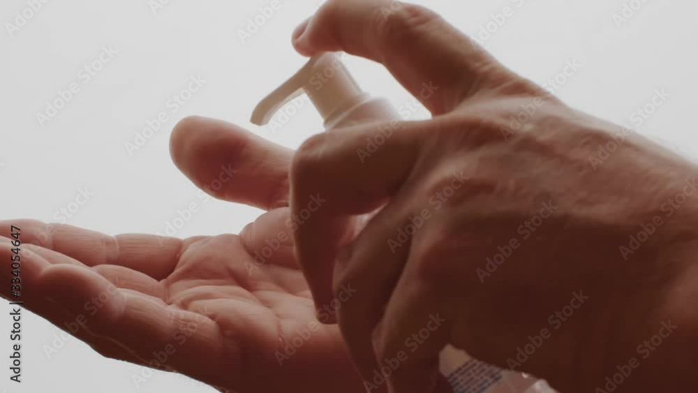 man washing his hand with hydro gel in slow motion man washing his hand with hydro gel in slow motion